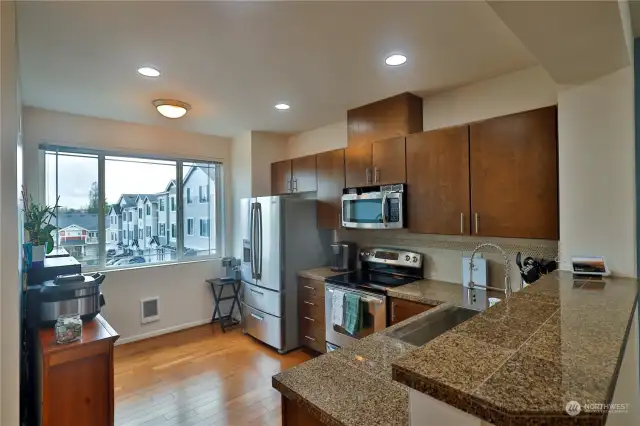 Nice size kitchen, with lots of natural light