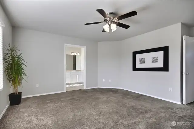 The expansive primary bedroom welcomes you with a double door entry and is adorned with a ceiling fan. Connected to it is a private primary bath, creating a harmonious and comfortable retreat.