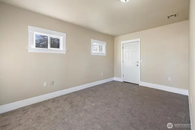 Downstairs bedroom with door to outside