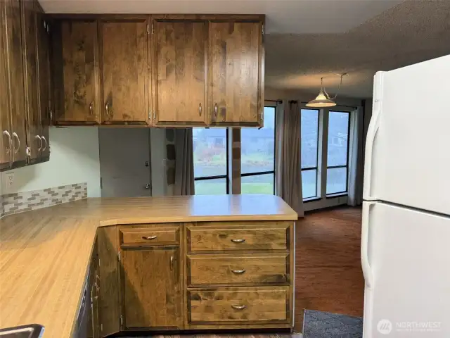 The kitchen overlooks the living room and dining area.