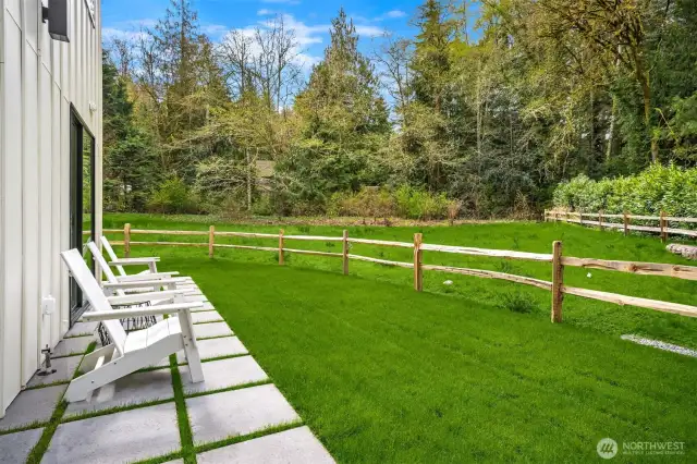 The home is sited on 1.03 acres and includes a protected wetland buffer ensuring privacy and natural beauty in perpetuity.