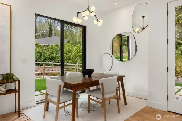 Framed with a set of sliding doors and highlighted with a unique, contemporary light fixture, the dining area is the perfect size to enterain.