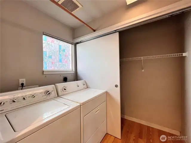 Laundry room beside kitchen