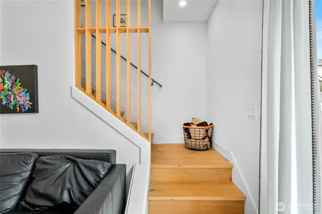 Classy wood finishes keep the space flowing to the upstairs.