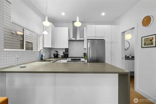 Oversized counter offers eating space- just add stools!