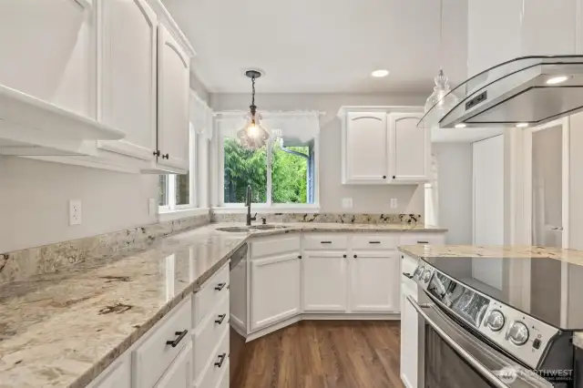 Light and bright kitchen! Beautiful hood and glass top stove/range!