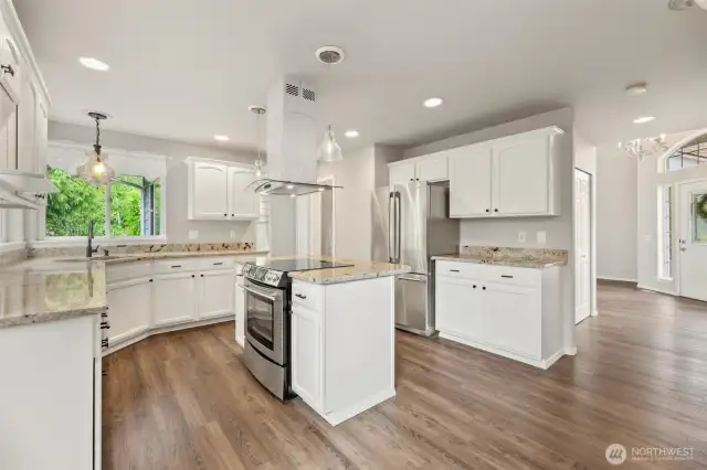 Stainless appliances and cabinets galore! Look out to the absolutely beautiful landscaping from the kitchen window!