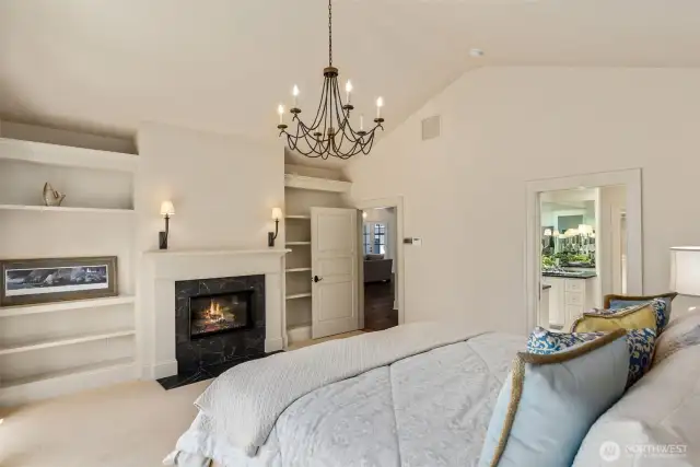 Primary bedroom featuring one of several fireplaces—perfect for cozying up during PNW winters.