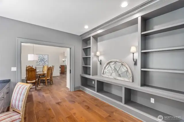 Library wall in study with elegant sliding doors—discreetly tucked away yet providing privacy when desired.