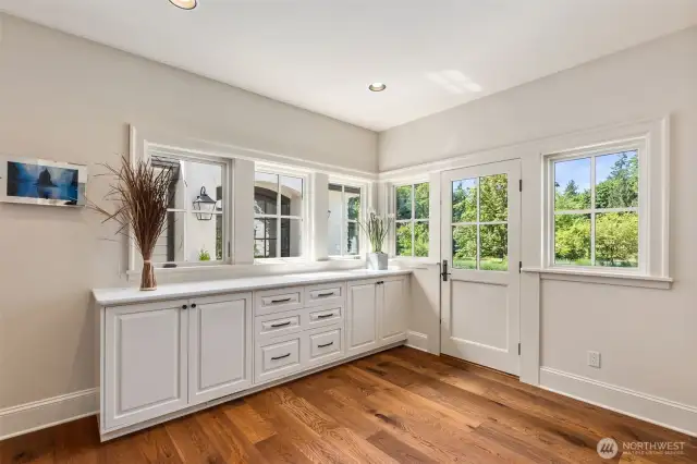 Elegant mudroom perfectly situated between the two wings of the home.