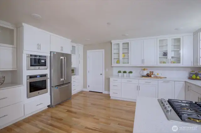 You'll love the abundance of cabinets and gorgeous quartz counters in this dream kitchen.