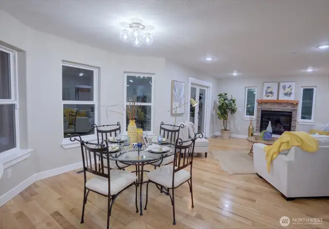Dining and living room are inviting, with lots of windows and light.