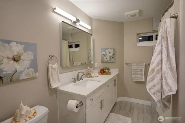 This is the hallway bathroom for the 2 other bedrooms on the middle level. It has a full shower/bathtub.