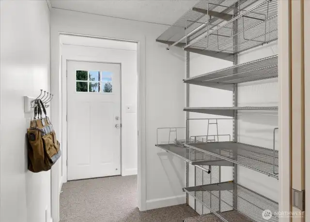 Entry boasts walk-thru mudroom/coat room with plenty of space for coats, shoes, backpacks and essentials. Excellent use of space.