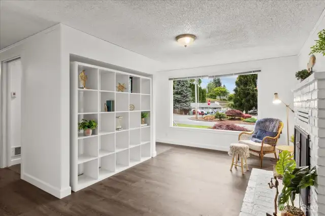 View of Front living area, walk thru mudroom/coatroom and built in bookshelf.