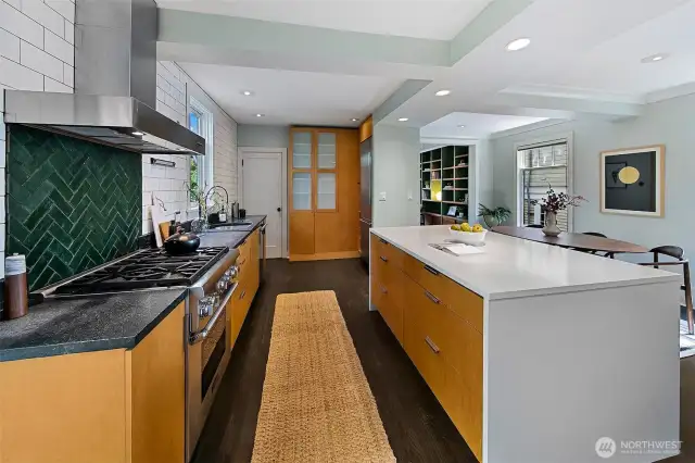 The center island creates definition of space in an elegant and thoughtful way.