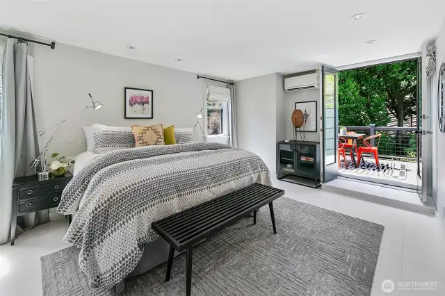 The primary bedroom is en-suite and features a roof deck with views.