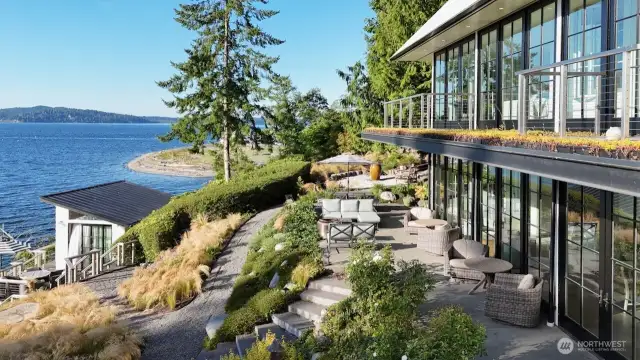 Crafted with steel-beam construction, the home features cantilevered decks that create striking lines while shading the main-level porch.