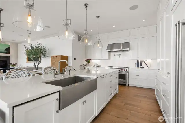Throughout the home, porcelain tile floors and hardwood stairs create a refined balance of durability and design.