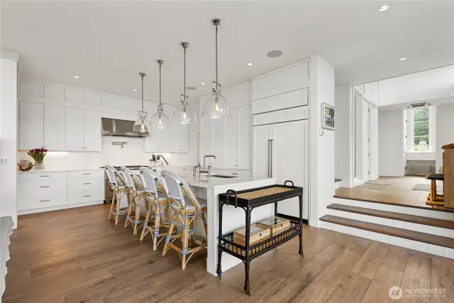 A sightline to the kitchen is balanced by the spacious breezeway entry on the right, creating a sense of flow and openness.