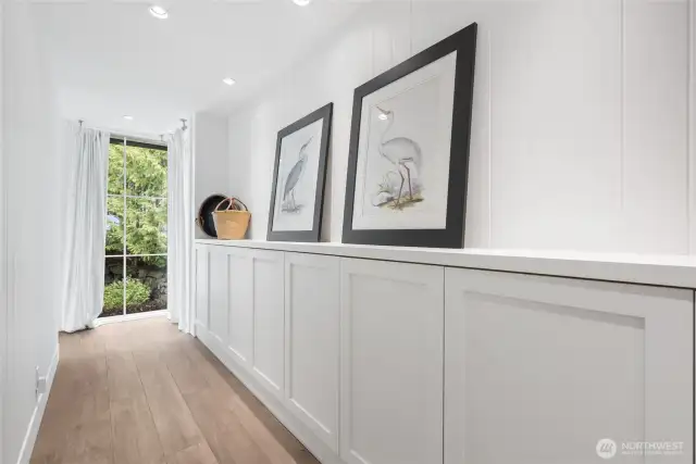 Thoughtful design includes built-in storage, gallery-style art walls, and corner windows that frame natural light.