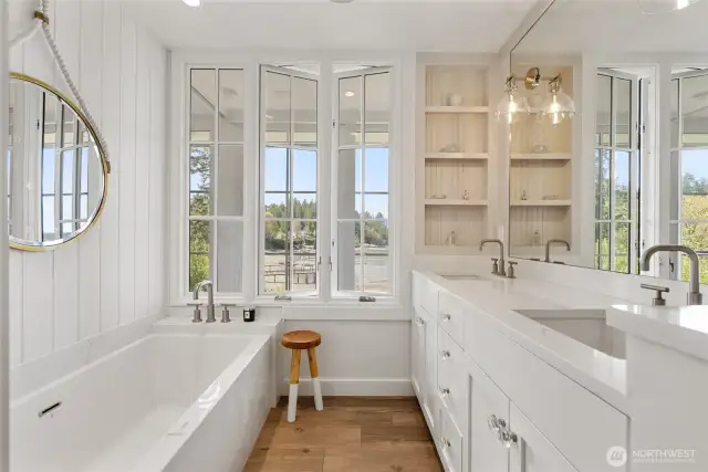 Two sinks, quartz counters, storage and variable lighting. Every bedroom has bathrooms with in-floor heat.