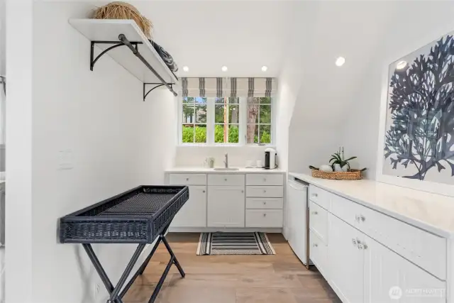 The primary suite is complemented by a private kitchenette—perfect for morning coffee or evening refreshments.