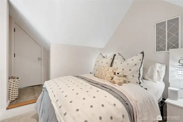The second bedroom features a loft design with an adjacent finished room to the left—ideal for office, studio, or storage.