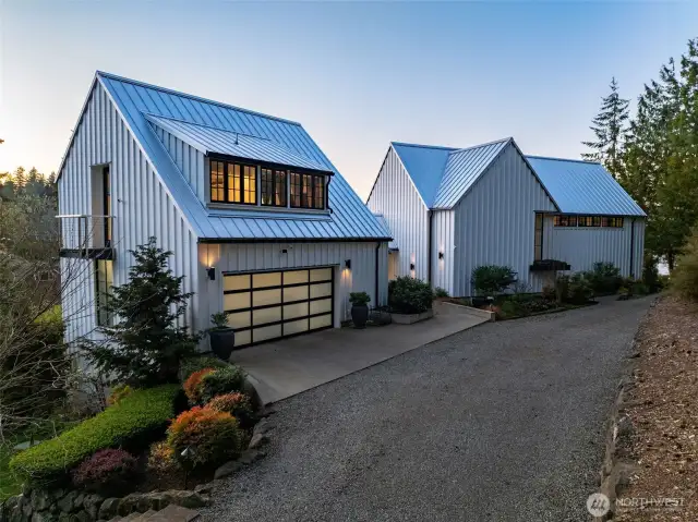 The 670 sq ft garage is outfitted with a NewAge metal cabinet system, offering abundant storage and workspace.