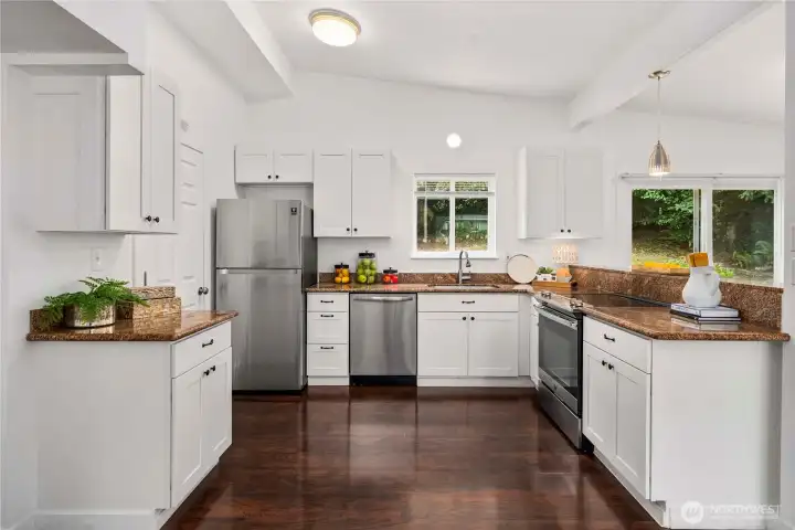This kitchen is made with storage, work zones and entertaining in mind - so perfect! The laundry room is right off the kitchen.