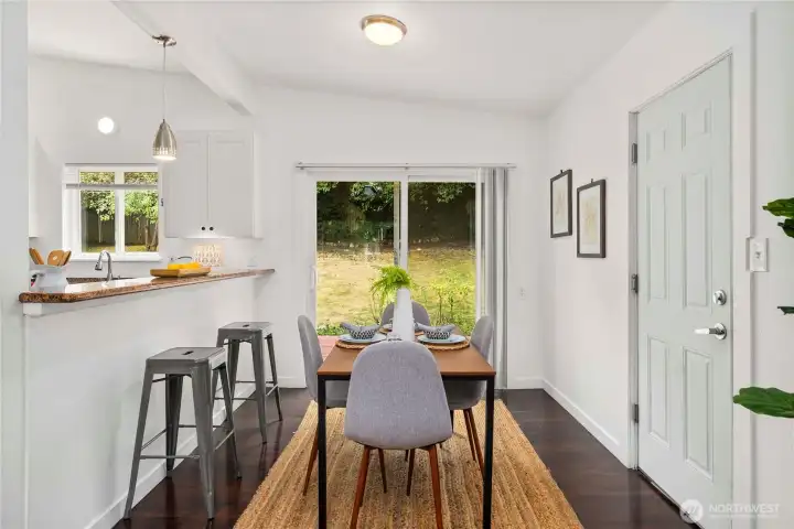 Dining with a backyard view!  Slider to the zero-step deck and out to the garage on the right.