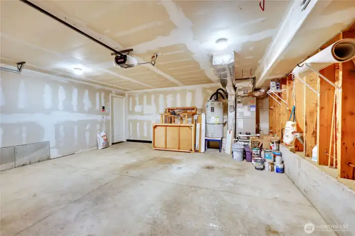 garage view of the furnace, and hot water tank