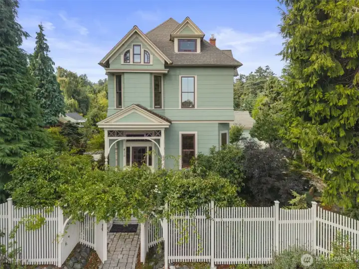 At nearly 140 years old, the original owners could sit in the parlor and watch sailing ships returning from the Alaska gold rush. The care and love which has been lavished on this home over the past century is apparent at every turn and in every corner of every room. The 12,100+ S.F. Lot has been lovingly transformed into a self sustaining Northwest paradise of native plants, evergreens and fruit trees with imported stone and masonry accenting every corner of this masterpiece of exterior design.