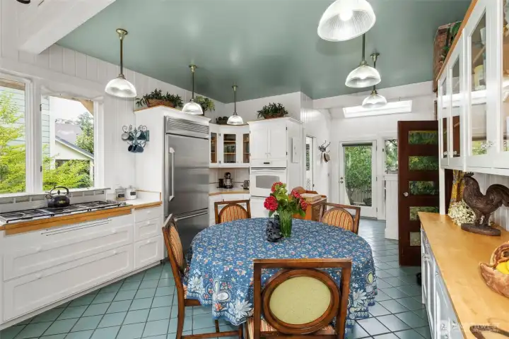 The bright and spacious kitchen with all of the modern amenities! Filled with light and a wonderful 'feel'. Both the cooking area and informal dining area, this is where you can access the various regions of the grounds- from entertaining on the east side, to a cookout on the West side.