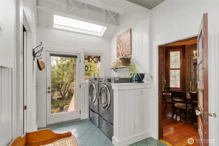 The East entrance. Informal and 'homey'. A 3/4 bath on one side and the laundry on the other. The dining room servers entrance is shown to the right.