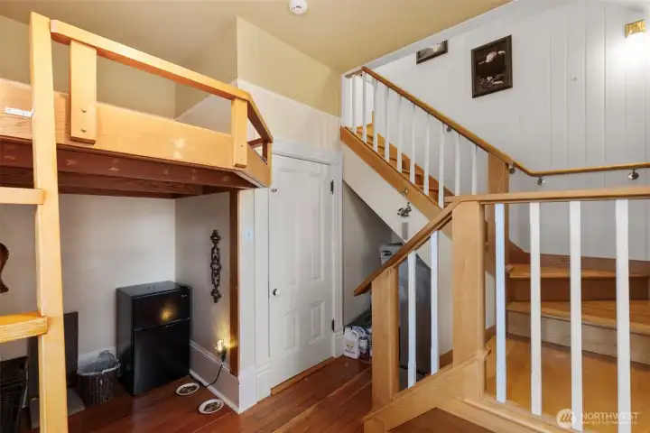 The corner room which is home to a childrens loft as well as the stairway to the 3rd floor living space bedroom. This room would be an ideal spot for guests and visitors.