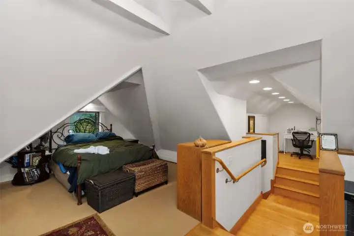 Another view of the 3rd floor "attic/loft" room. At the top of the stairs there is a small work space to the left. To the right the room opens up and has limitless possibilities. One could partition it off and make an additional room if desired- there's that much space.