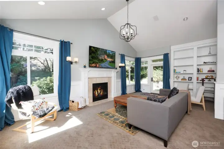 Luxurious Primary Suite offers a fireside living room & library with a walk-out deck and patio.