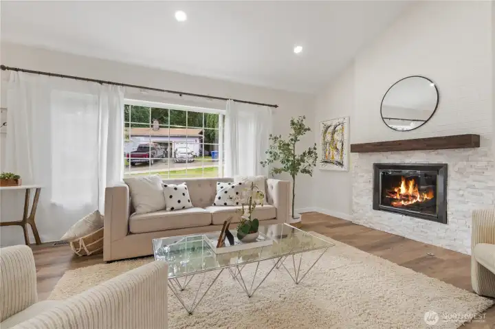 Living room with fireplace and large windows