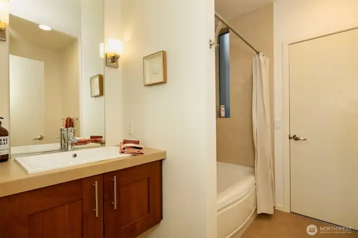 2nd floor full bathroom with ceramic tile flooring & shower surround.