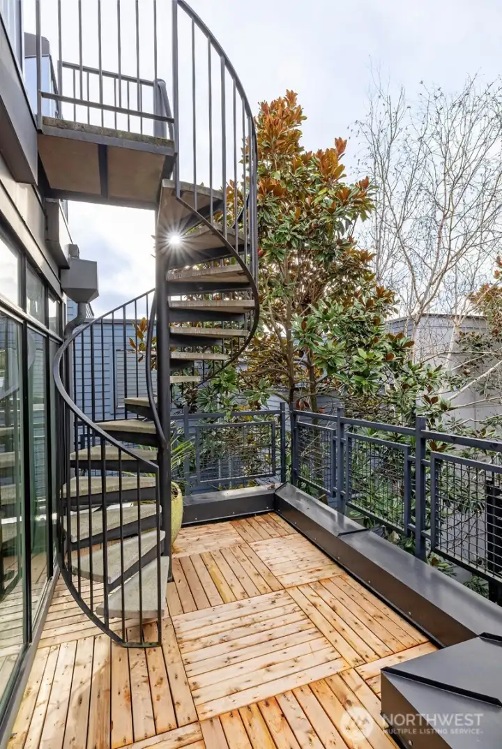 Spiral staircase to roof top deck