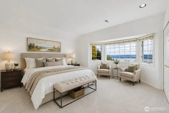 Primary suite has sunrise view. Digitally staged.