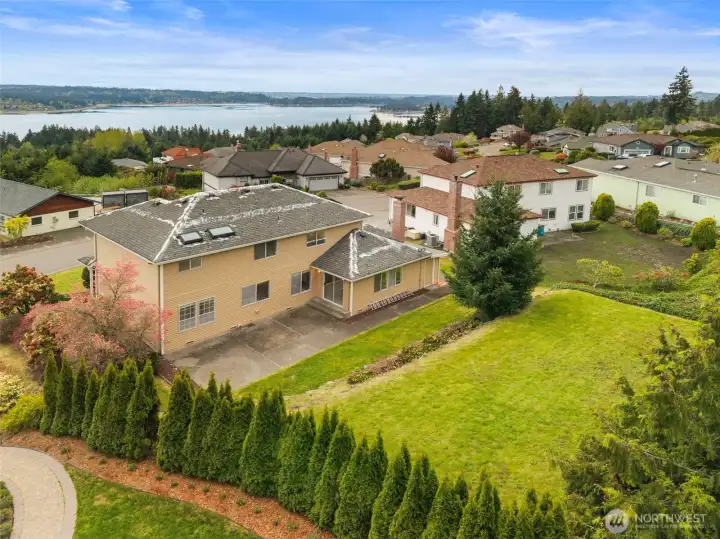 Large grassy area in upper yard. Sunny spot for garden!