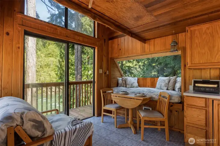 COZY RIVER RETREAT.  Innovative seating doubles as sleeping to maximize space.