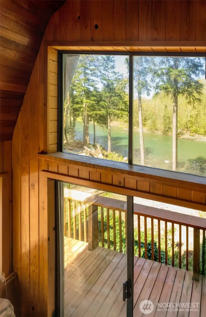 Loft bdrm offers a rare vantage point ~ enjoy waking up to the sound of the water.