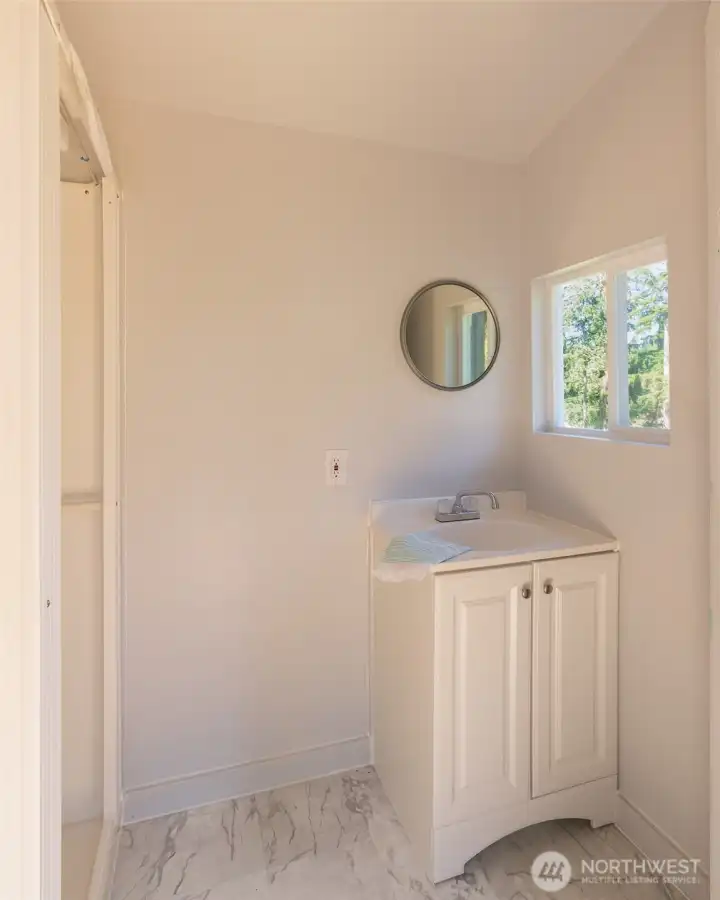 Detached washhouse with shower & vanity.  Seller credit offered toward incinerator or composting toilet.