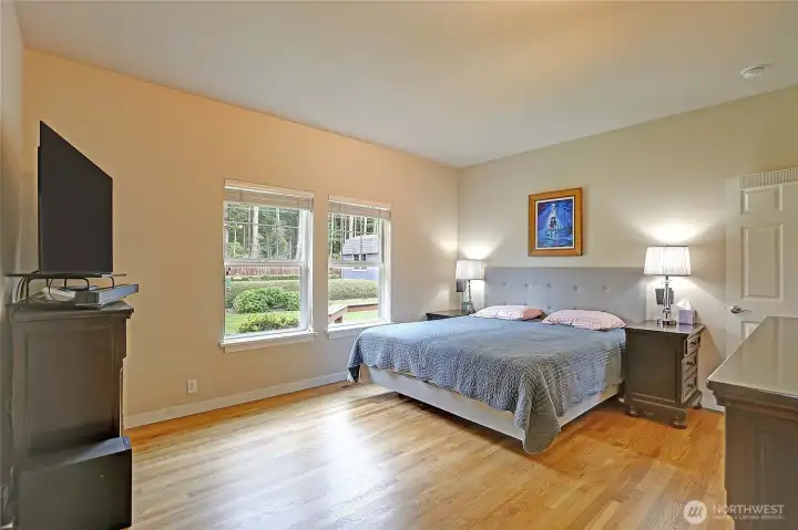 Primary bedroom w/ walk-in closet & ADA bathroom.