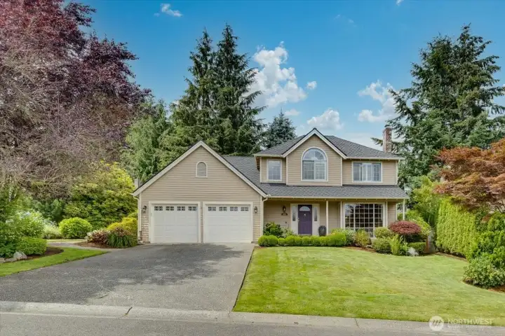 The exterior has recently been painted and newer gutters in place.  The roof looks great and has many years left for sure!  Nicely landscaped and also architectually captivating!
