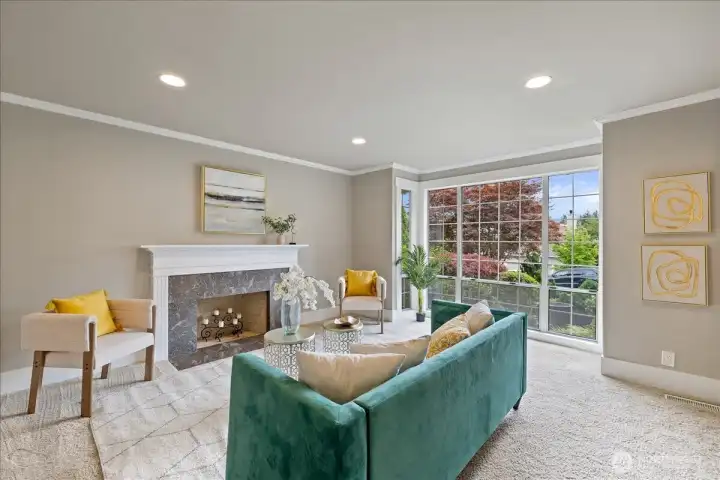 Open bright living room with wood burning fireplace and picturesque window!