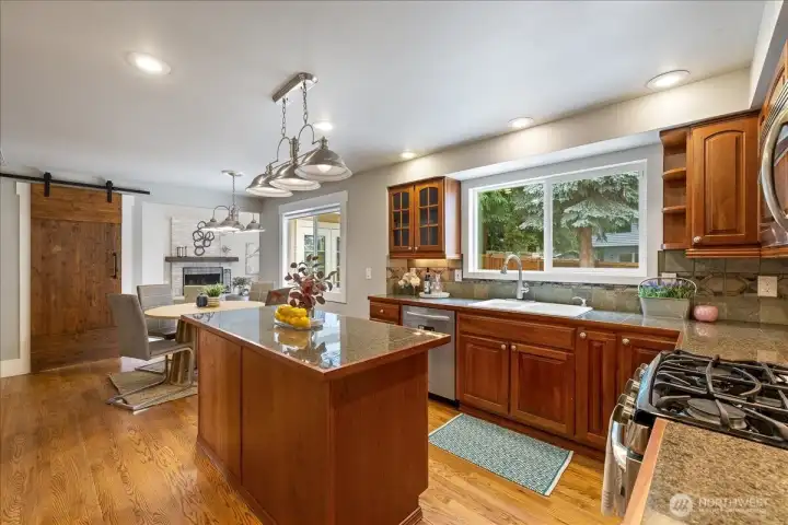 Another view of the spacious kitchen with window looking out to the beautiful backyard!